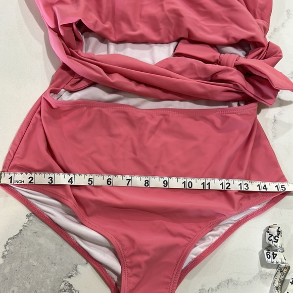 Adorable new never worn pink cut out one piece swimsuit. - Picture 7 of 9